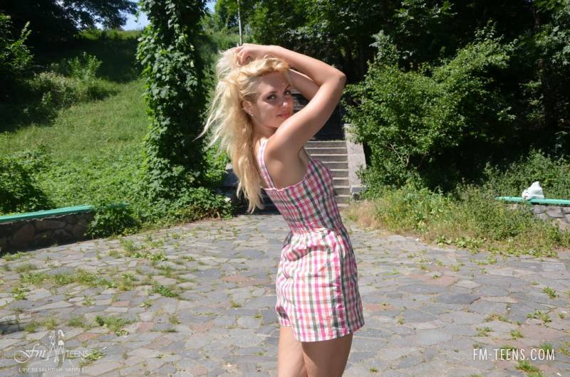 Cute Blonde Undresses In The Sunshine